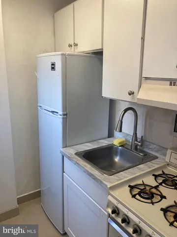 a kitchen with a sink and a stove