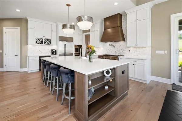 a kitchen with a stove a sink and a refrigerator