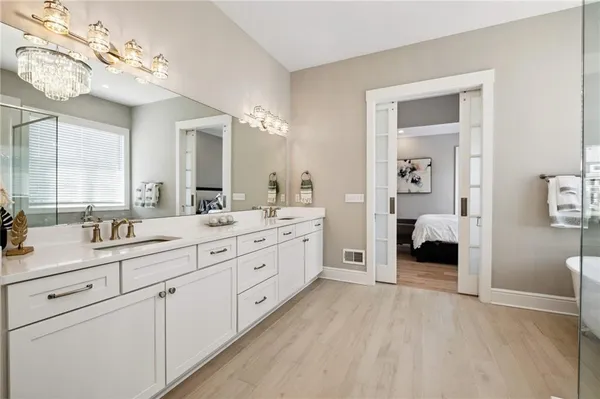 a bathroom with a tub and shower