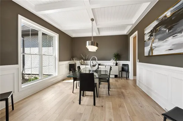 a living room with stainless steel appliances kitchen island granite countertop furniture and a couch