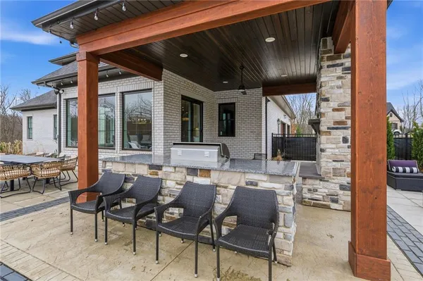 a front view of house with yard and outdoor seating