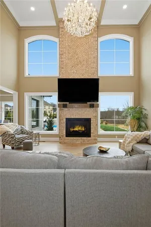 a living room with furniture fireplace and a flat screen tv