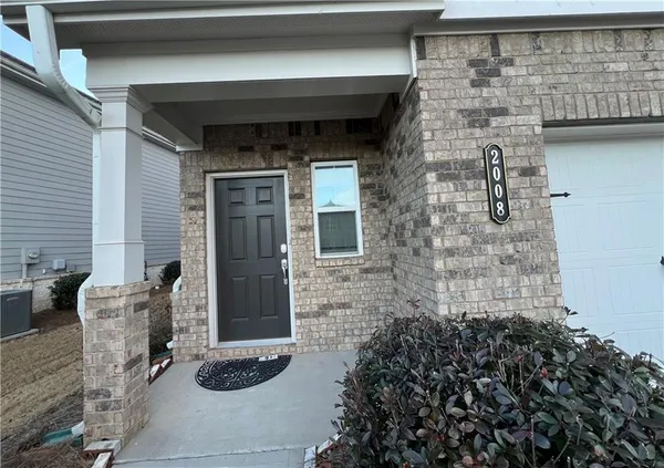 a front view of a house with patio