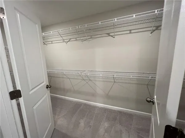 a view of a room with racks on the wall