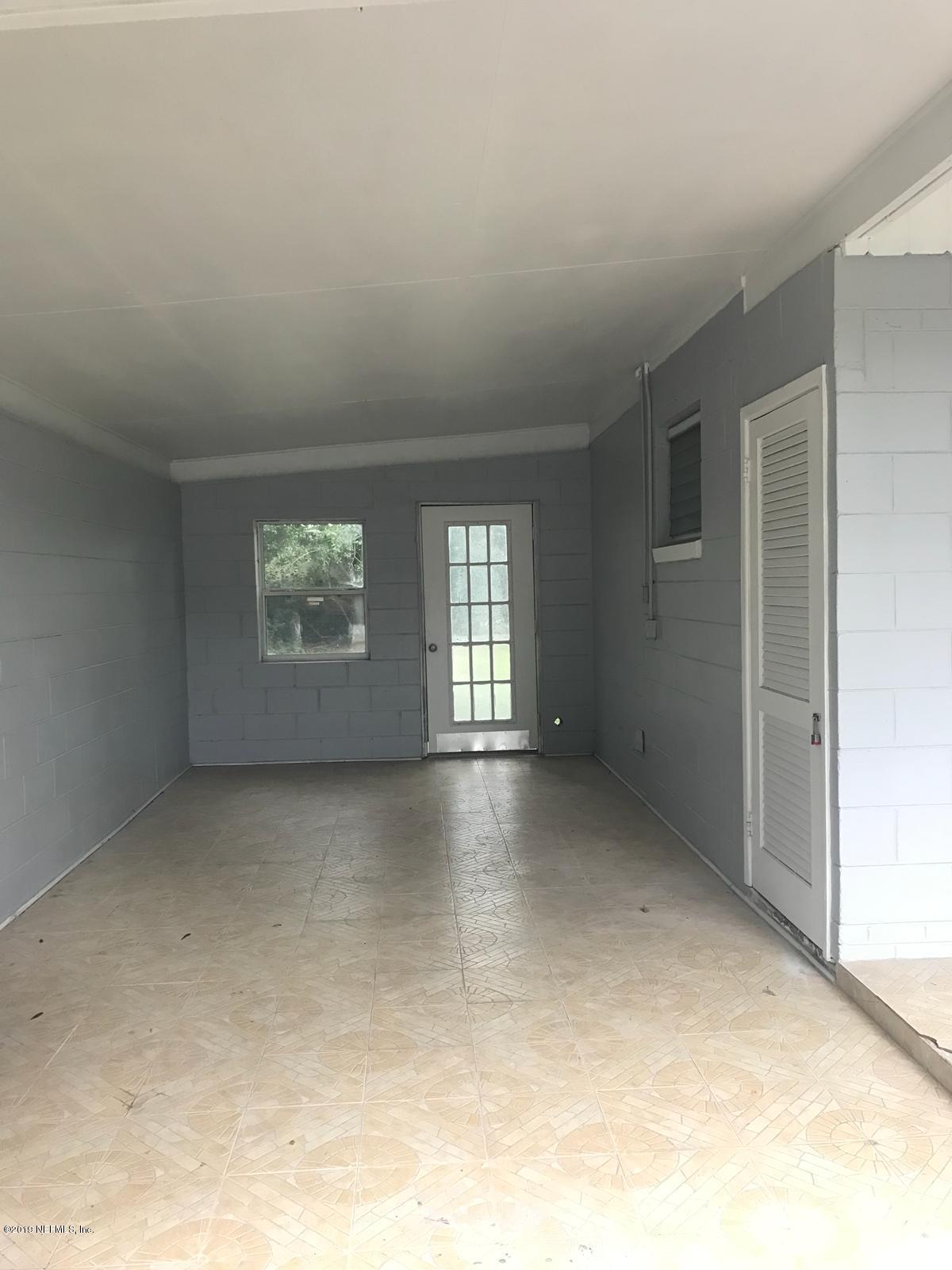 4705 Ruckner Road Jacksonville, FL 32207 - Photo 17 of 24 an empty room with windows