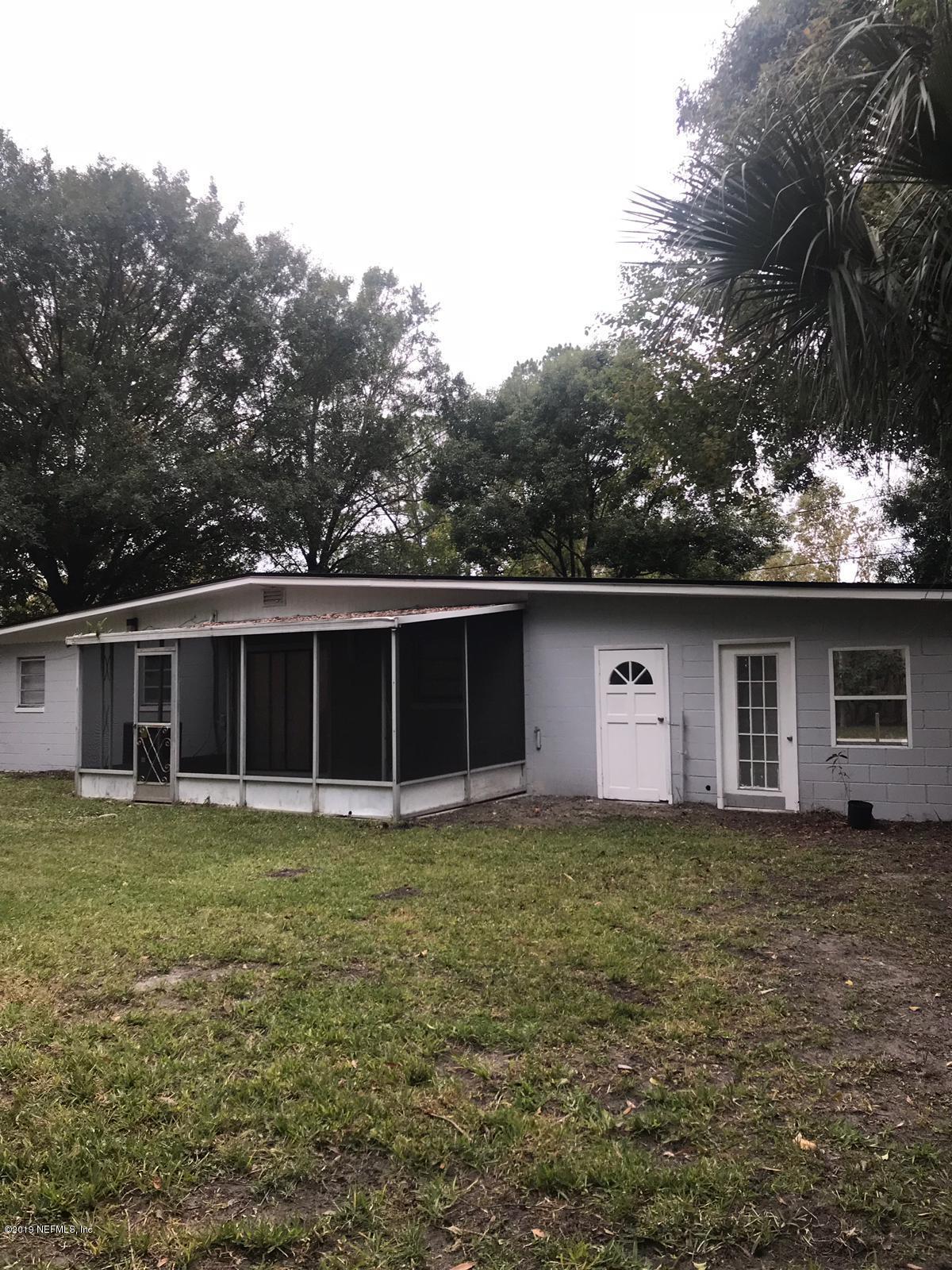 4705 Ruckner Road Jacksonville, FL 32207 - Photo 20 of 24 a house with trees in the background