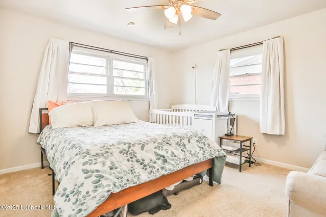 a bedroom with a bed and a table in it