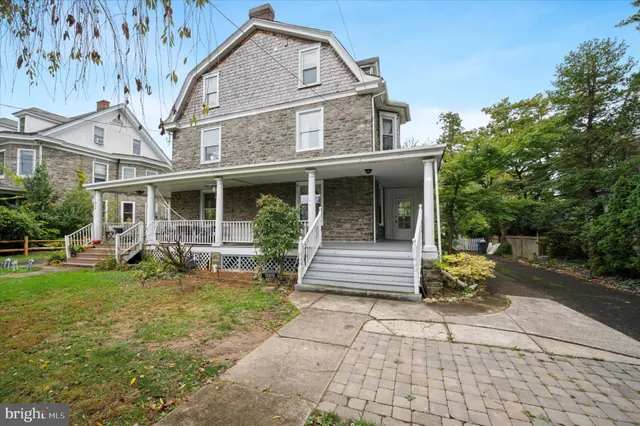 a view of a house with garden and porch