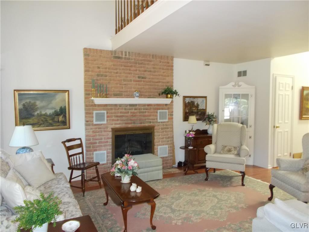 1201 Butztown Road, Unit 16 Bethlehem, PA 18017 - Photo 7 of 11 a living room with furniture and a fireplace