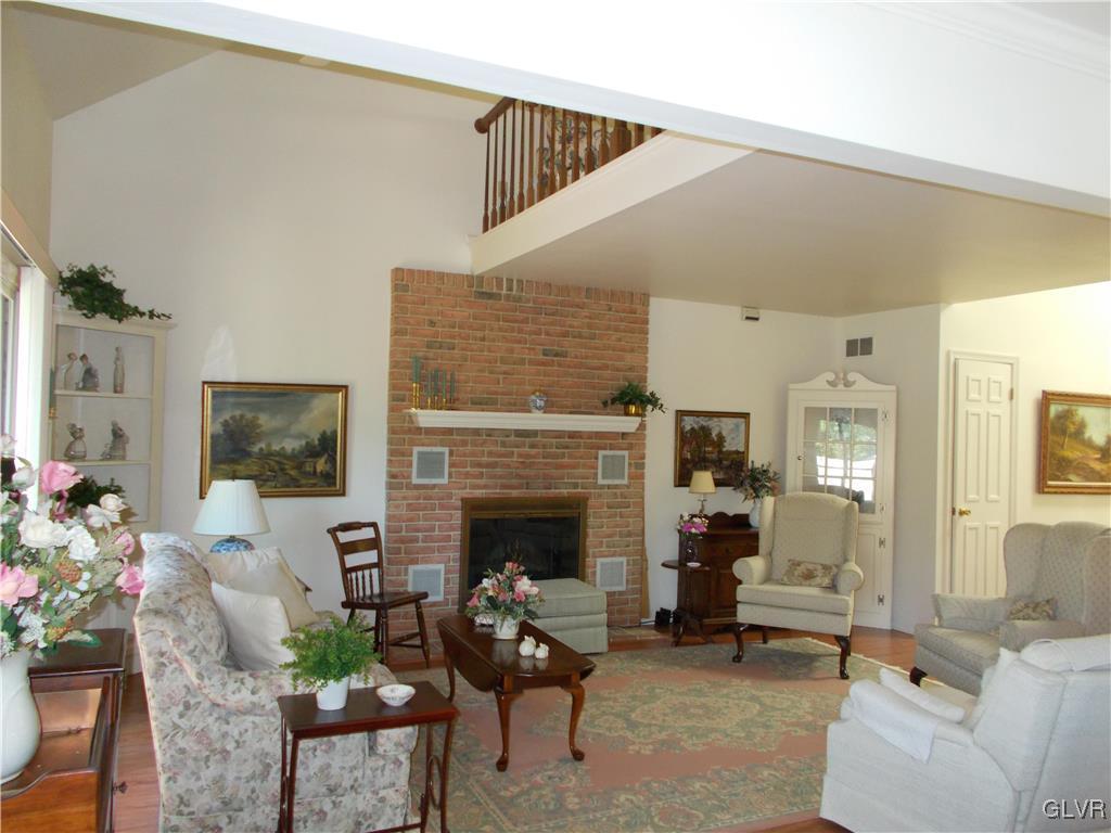 1201 Butztown Road, Unit 16 Bethlehem, PA 18017 - Photo 8 of 11 a living room with furniture and a fireplace