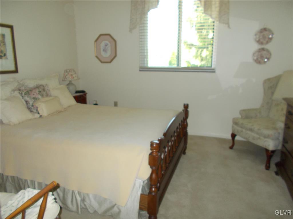 1201 Butztown Road, Unit 16 Bethlehem, PA 18017 - Photo 10 of 11 a view of a room that has a bed and a chair