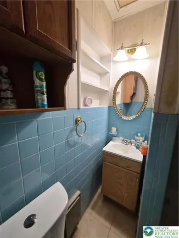 a bathroom with a sink and mirror