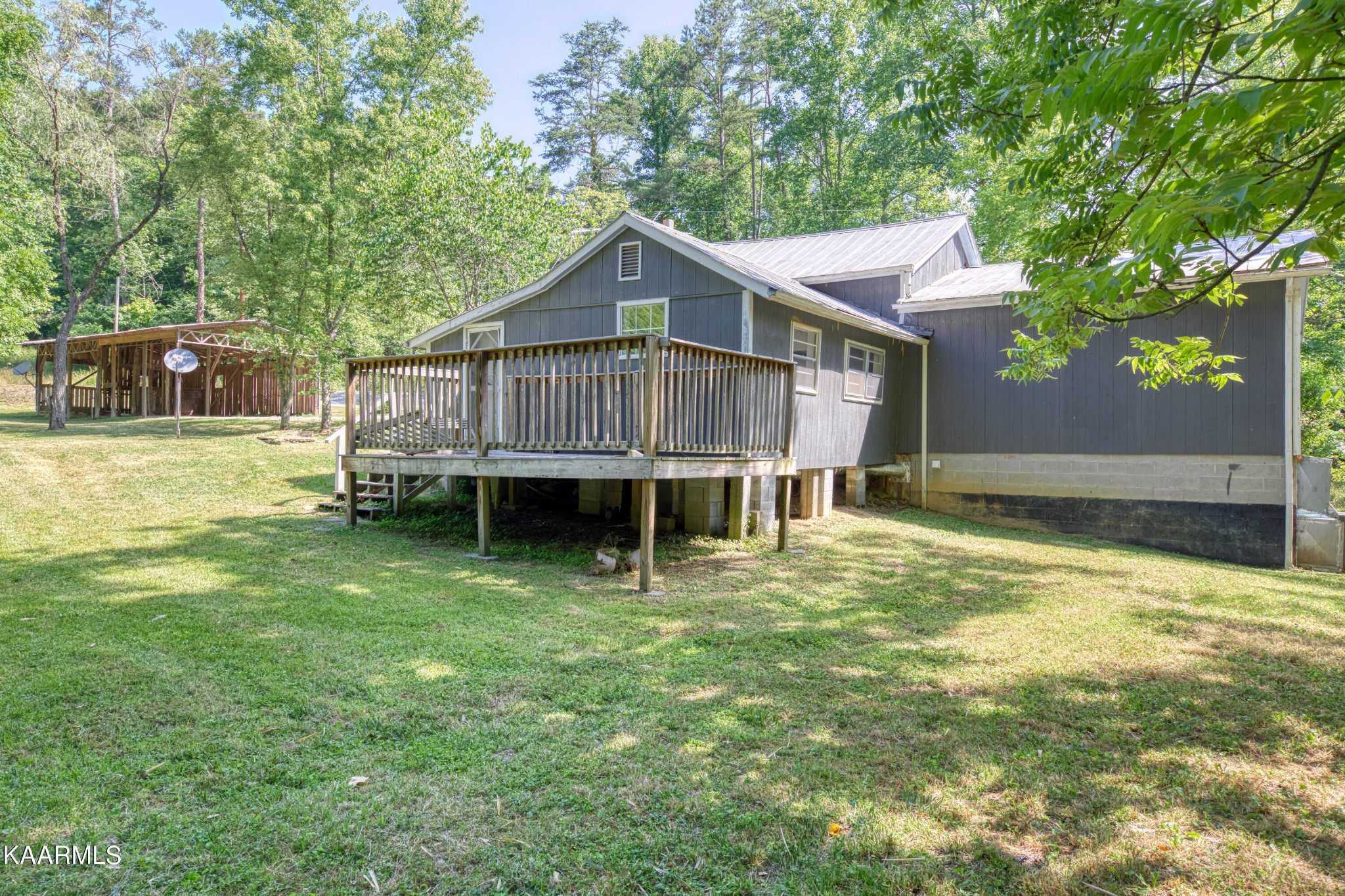 764 Mt Olive Road Andersonville, TN 37705 - Photo 16 of 37 a view of a house with a yard balcony and sitting area