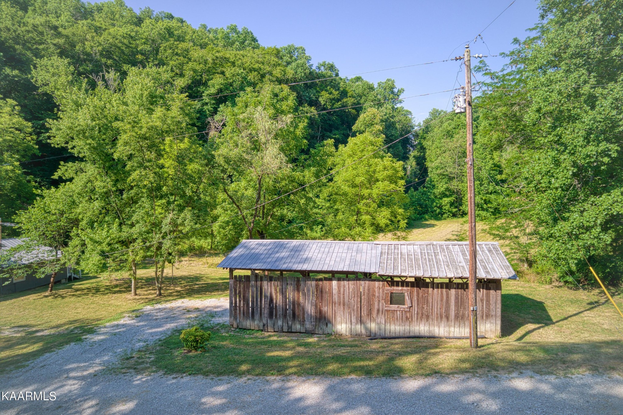764 Mt Olive Road Andersonville, TN 37705 - Photo 20 of 37 a wooden fence with trees in the background