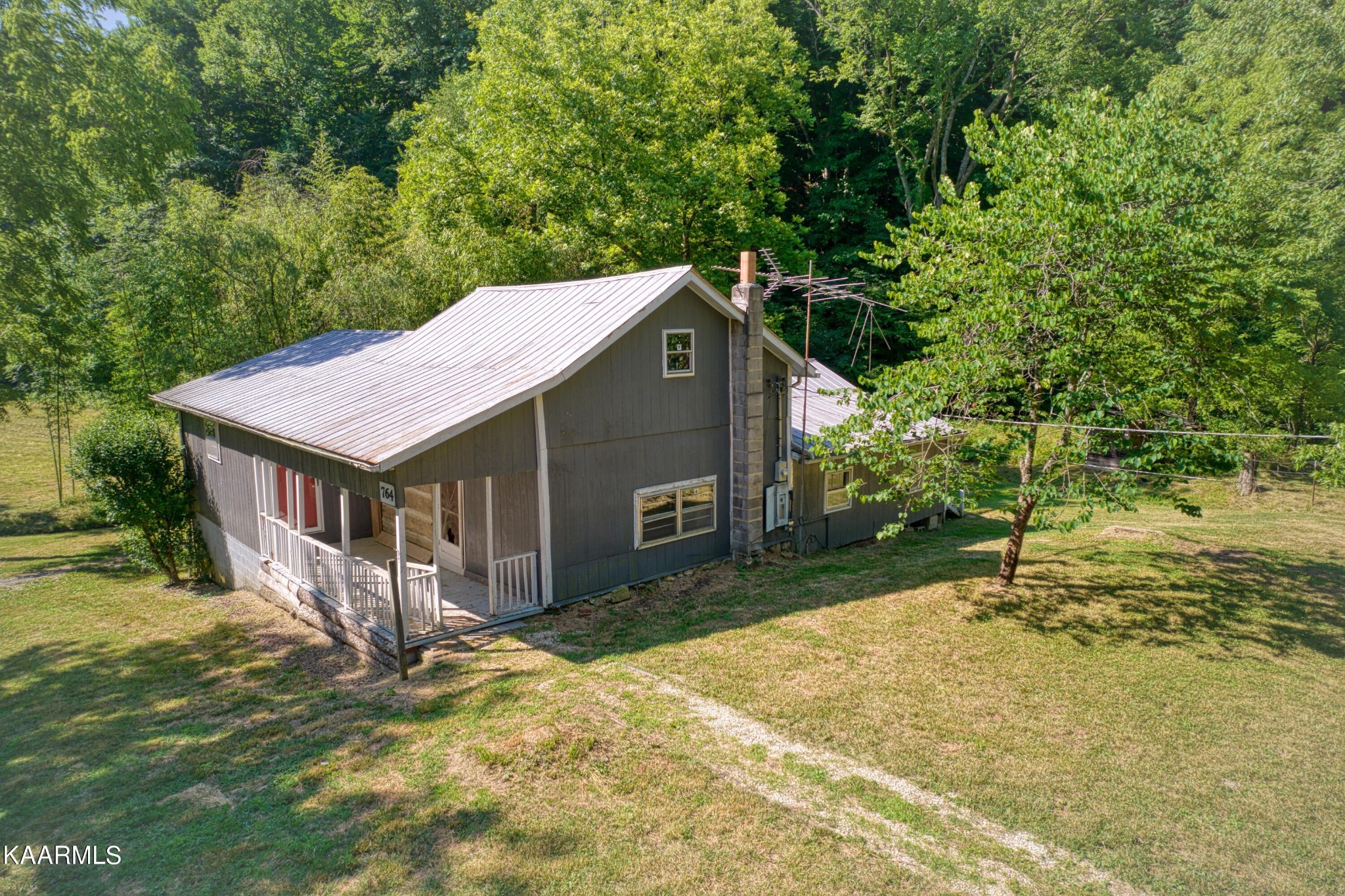 764 Mt Olive Road Andersonville, TN 37705 - Photo 27 of 37 a house with trees in the background