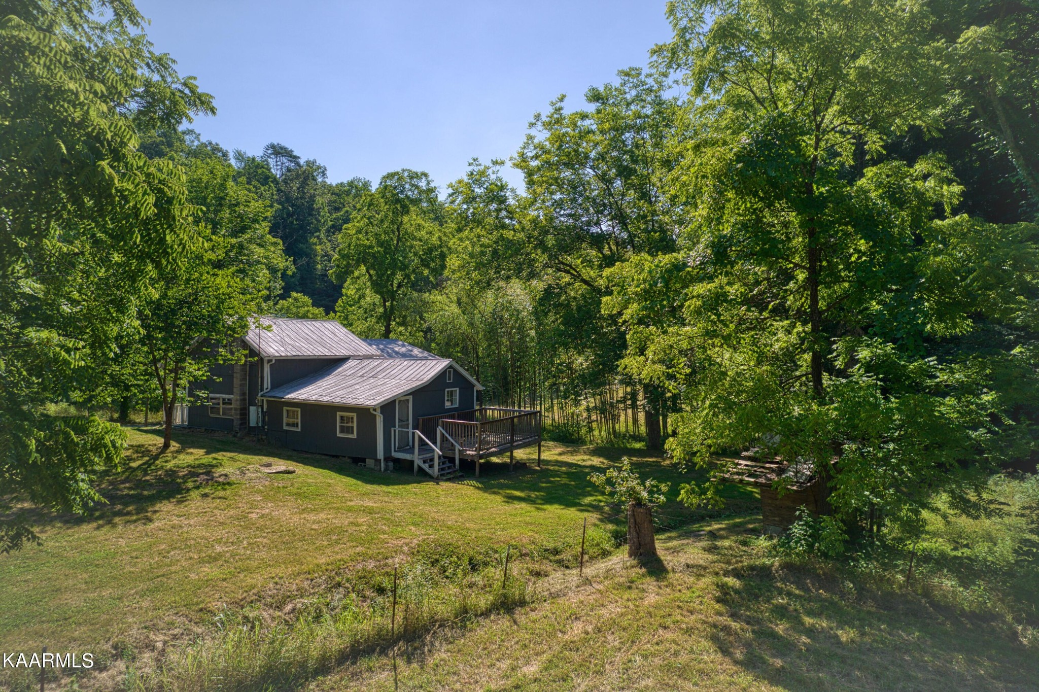 764 Mt Olive Road Andersonville, TN 37705 - Photo 29 of 37 a swimming pool with outdoor seating and yard