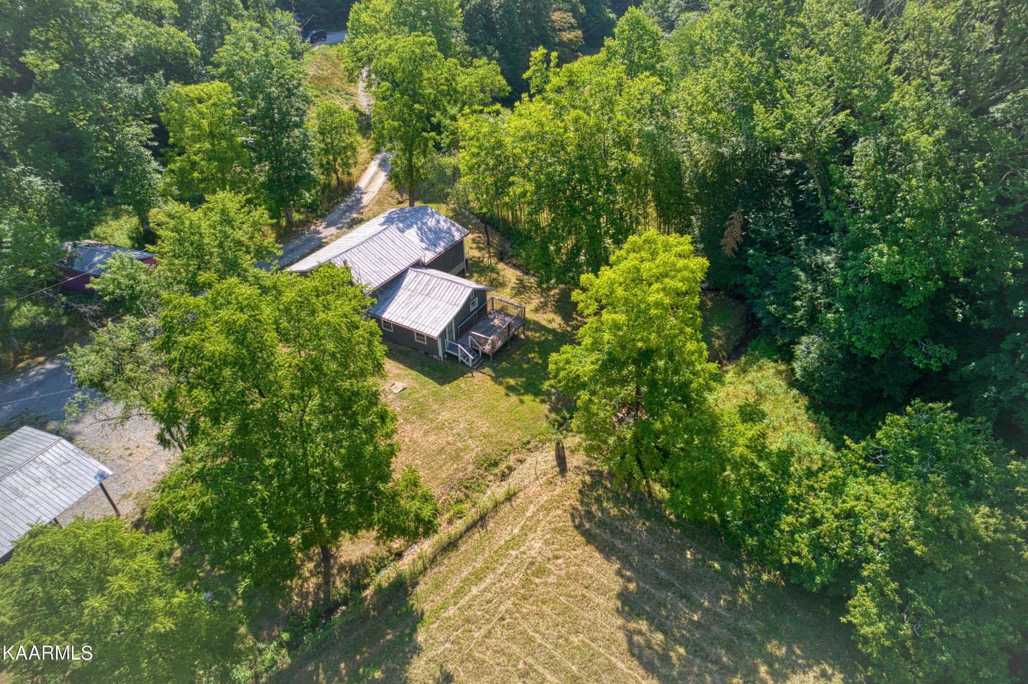 764 Mt Olive Road Andersonville, TN 37705 - Photo 30 of 37 an aerial view of residential house with outdoor space and trees all around