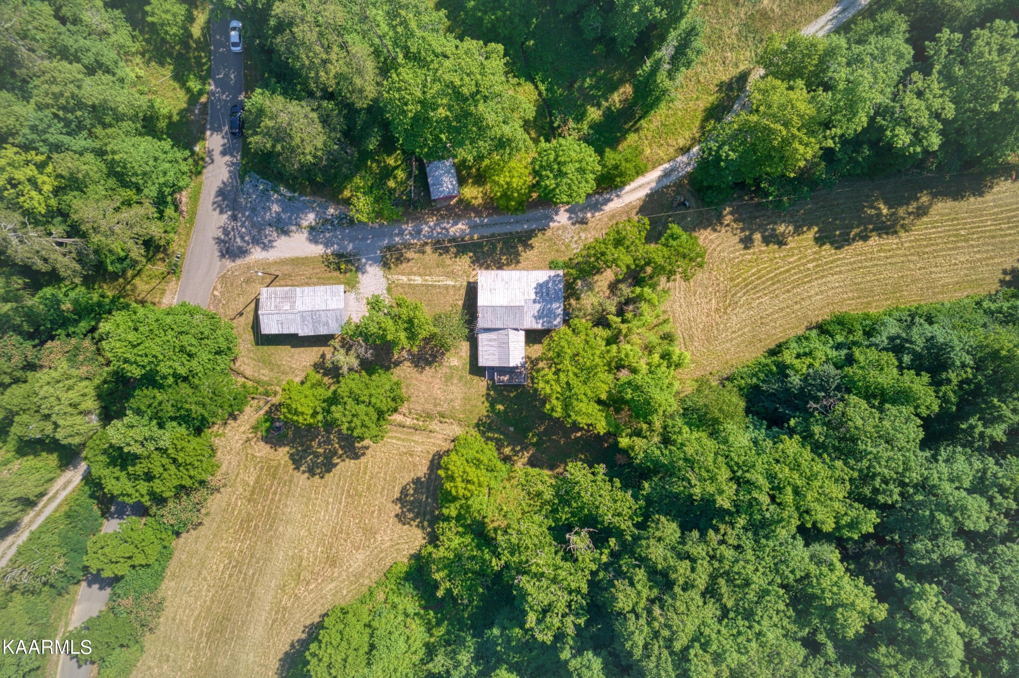 764 Mt Olive Road Andersonville, TN 37705 - Photo 35 of 37 an aerial view of a house with a lake view