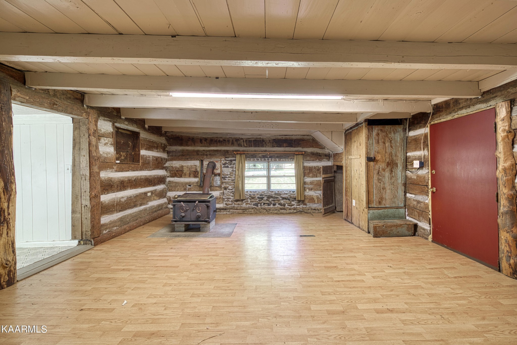 764 Mt Olive Road Andersonville, TN 37705 - Photo 8 of 37 a view of empty room with wooden floor and fireplace