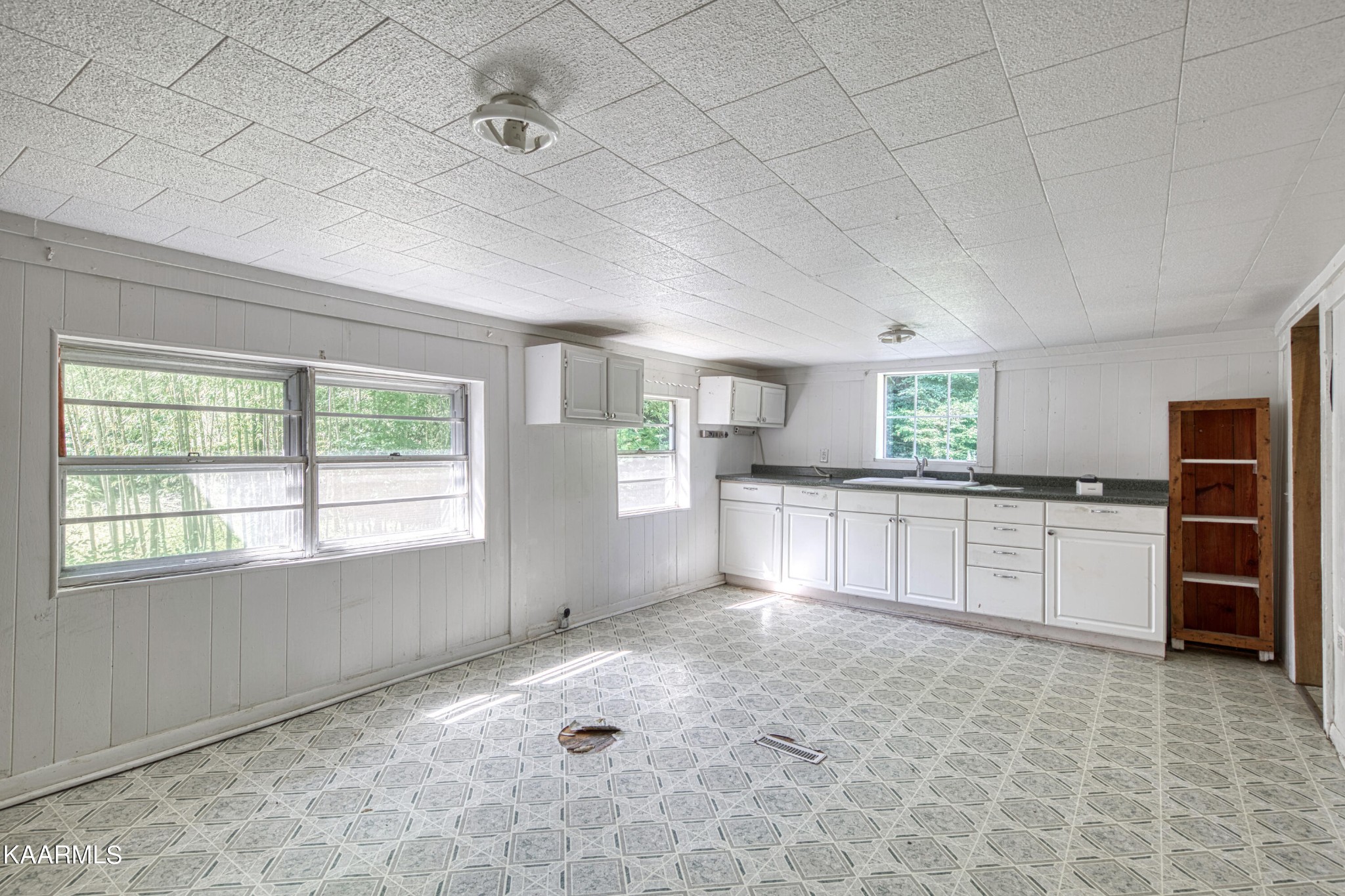 764 Mt Olive Road Andersonville, TN 37705 - Photo 9 of 37 a large white kitchen with a stove a sink dishwasher and a refrigerator