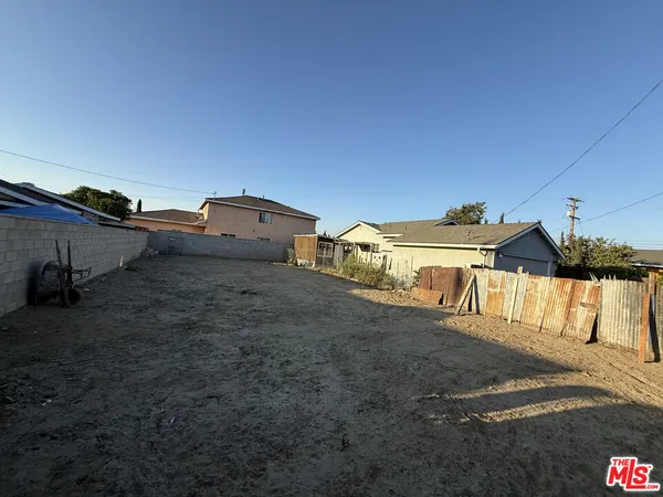 a view of a street in front of a house
