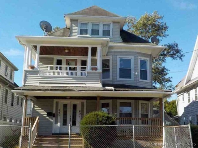 695-697 Laurel Avenue Bridgeport, CT 06604 - Photo 1 of 2 a front view of a house with balcony