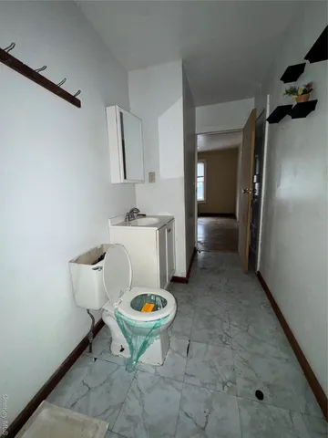 a view of a room with table and chairs