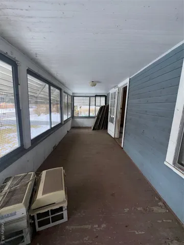 a view of room with furniture and windows