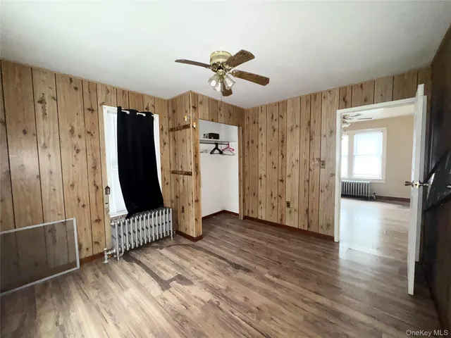 a view of entryway with wooden floor