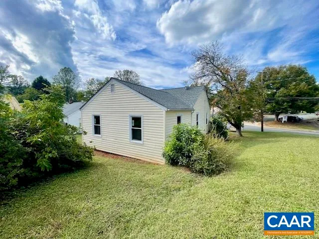 a view of a backyard of the house