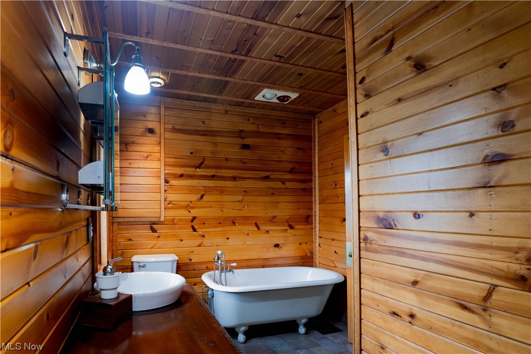 170 Avon Belden Road Avon Lake, OH 44012 - Photo 18 of 18 Bathroom featuring wooden ceiling, wood walls, and toilet