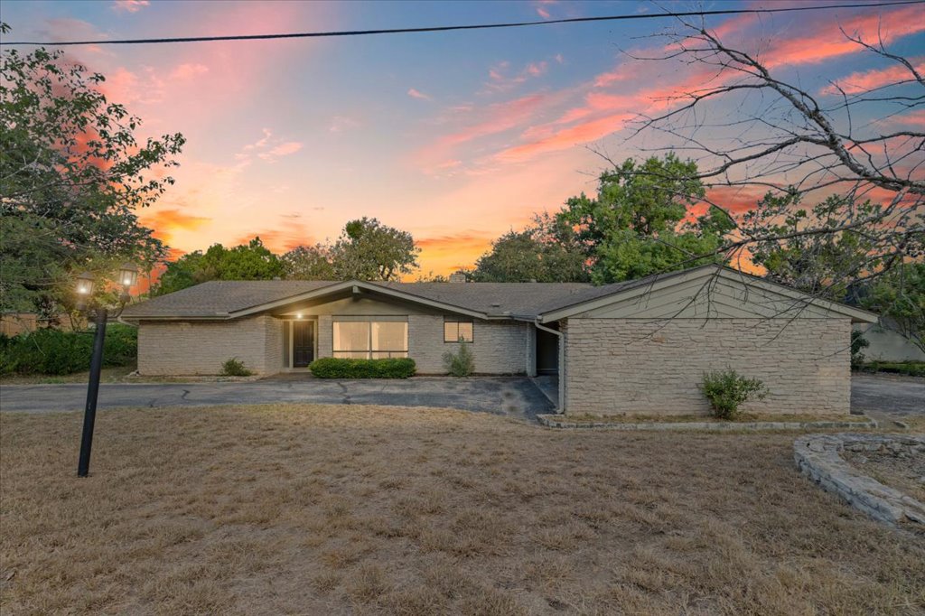 313 Comet Lakeway, TX 78734 - Photo 2 of 17 Single Family home featuring a large front yard and brick siding