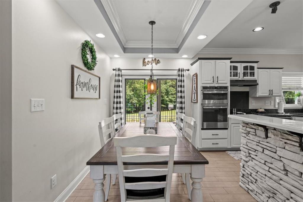 3002 Highway 101 Rockmart, GA 30153 - Photo 18 of 78 a kitchen with kitchen island a counter space a large window and cabinets