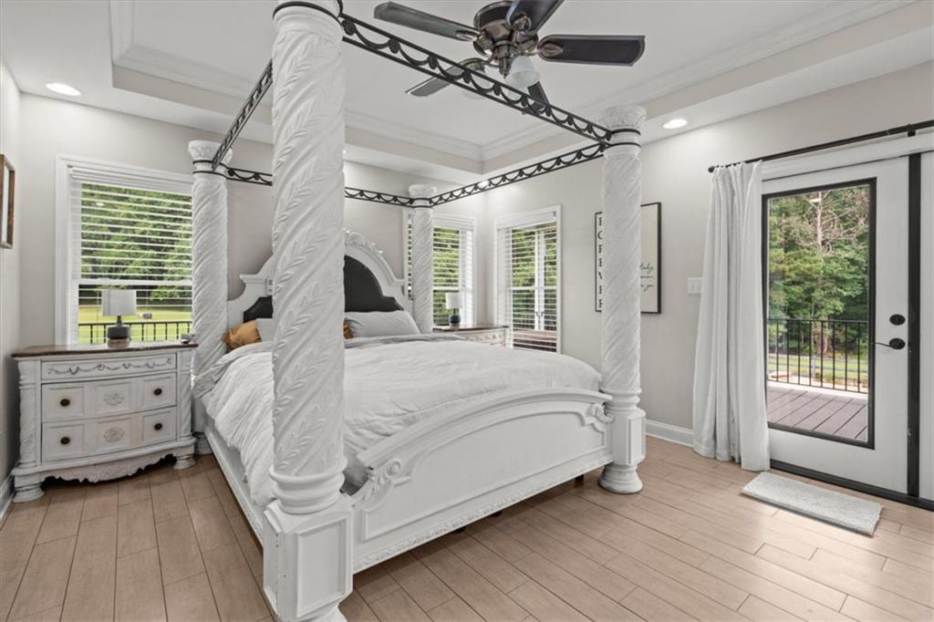 3002 Highway 101 Rockmart, GA 30153 - Photo 27 of 78 a bed sitting in a bedroom next to a window