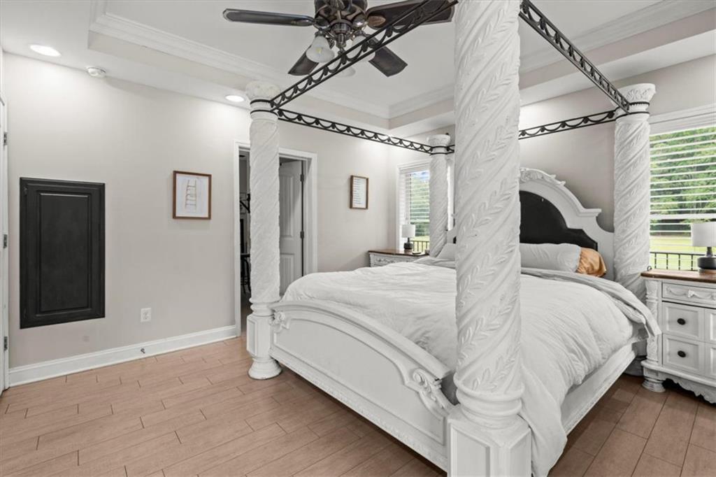 3002 Highway 101 Rockmart, GA 30153 - Photo 28 of 78 a bedroom with a large bed and a chandelier