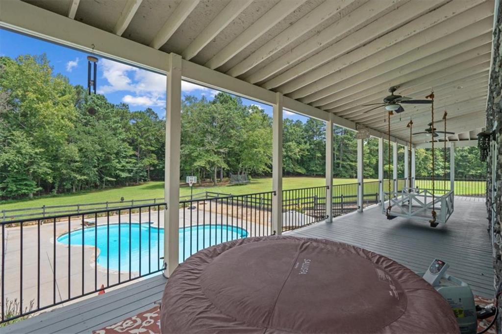 3002 Highway 101 Rockmart, GA 30153 - Photo 32 of 78 a view of a patio with a table chairs and a small yard