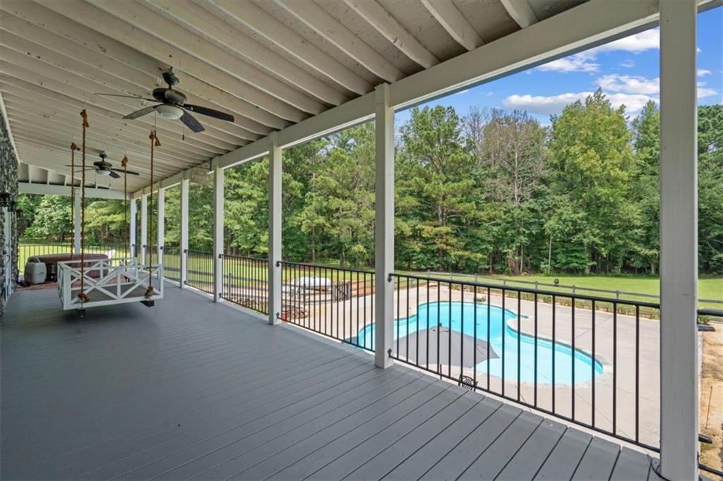 3002 Highway 101 Rockmart, GA 30153 - Photo 34 of 78 a view of a porch with furniture and a backyard
