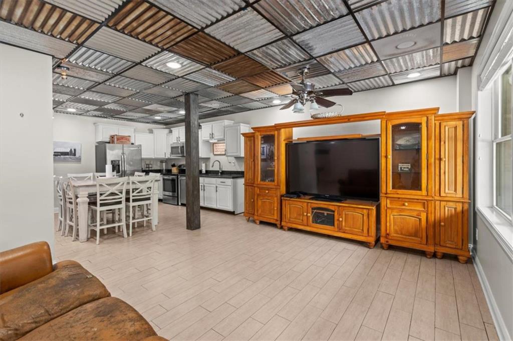 3002 Highway 101 Rockmart, GA 30153 - Photo 44 of 78 a living room with furniture and a flat screen tv