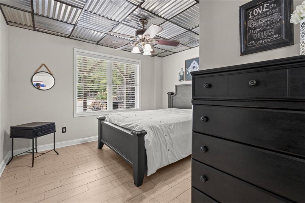 3002 Highway 101 Rockmart, GA 30153 - Photo 50 of 78 a spacious bedroom with a bed and a chandelier