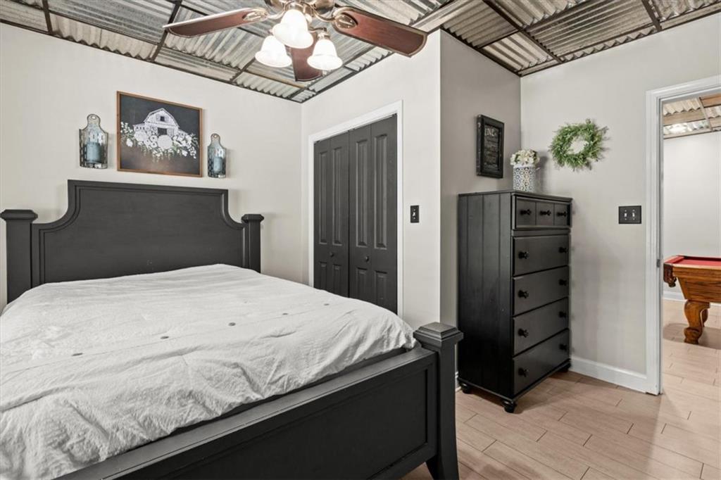 3002 Highway 101 Rockmart, GA 30153 - Photo 51 of 78 a bedroom with a bed and a walk in closet