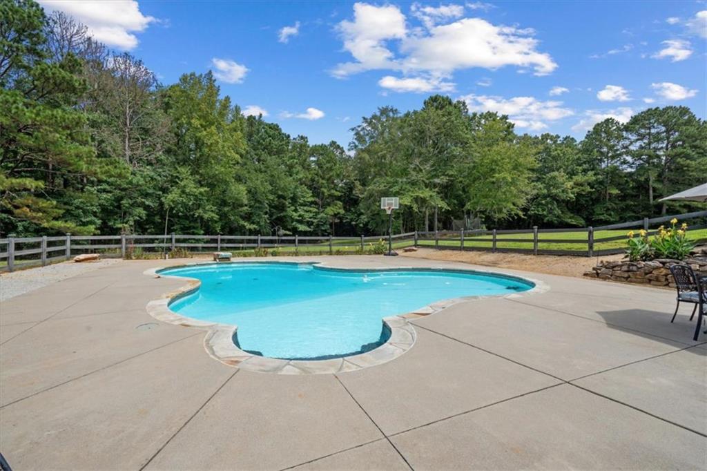 3002 Highway 101 Rockmart, GA 30153 - Photo 61 of 78 a view of a swimming pool and trees in the background