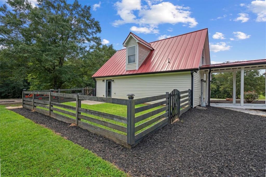 3002 Highway 101 Rockmart, GA 30153 - Photo 65 of 78 a view of a house with a yard and sitting area