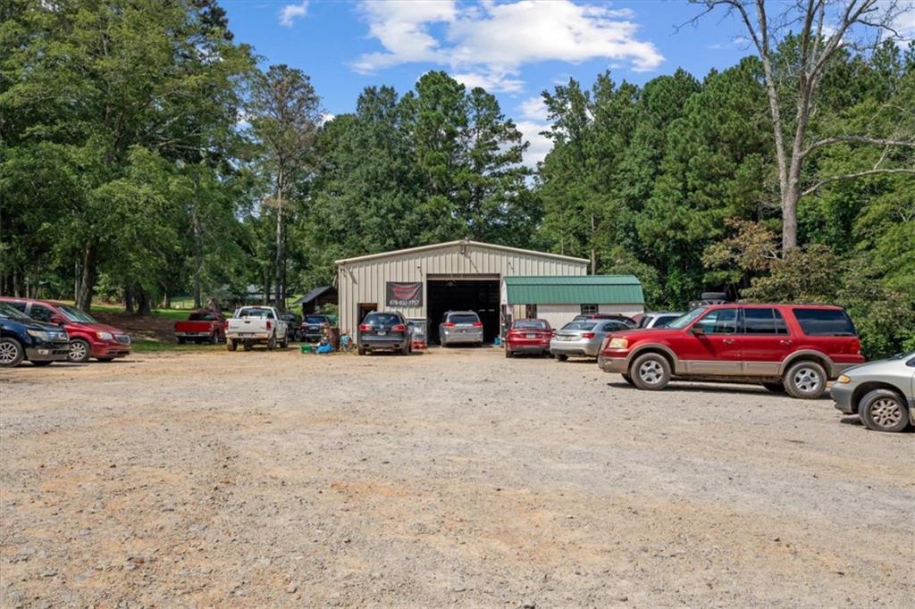 3002 Highway 101 Rockmart, GA 30153 - Photo 78 of 78 a view of a cars parked in front of a house