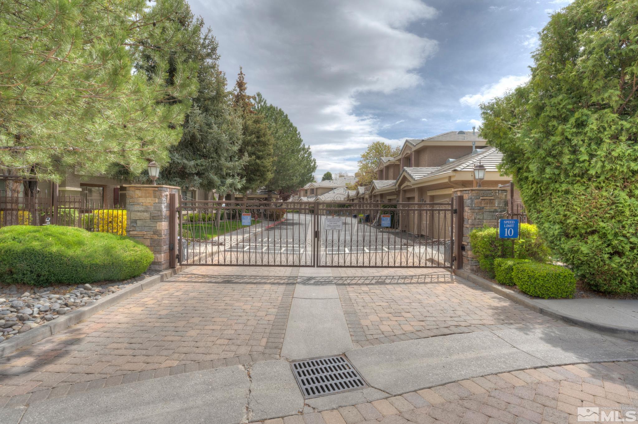 900 S Meadows, Unit 613 Reno, NV 89521 - Photo 26 of 40 a view of a pathway with a wrought fence