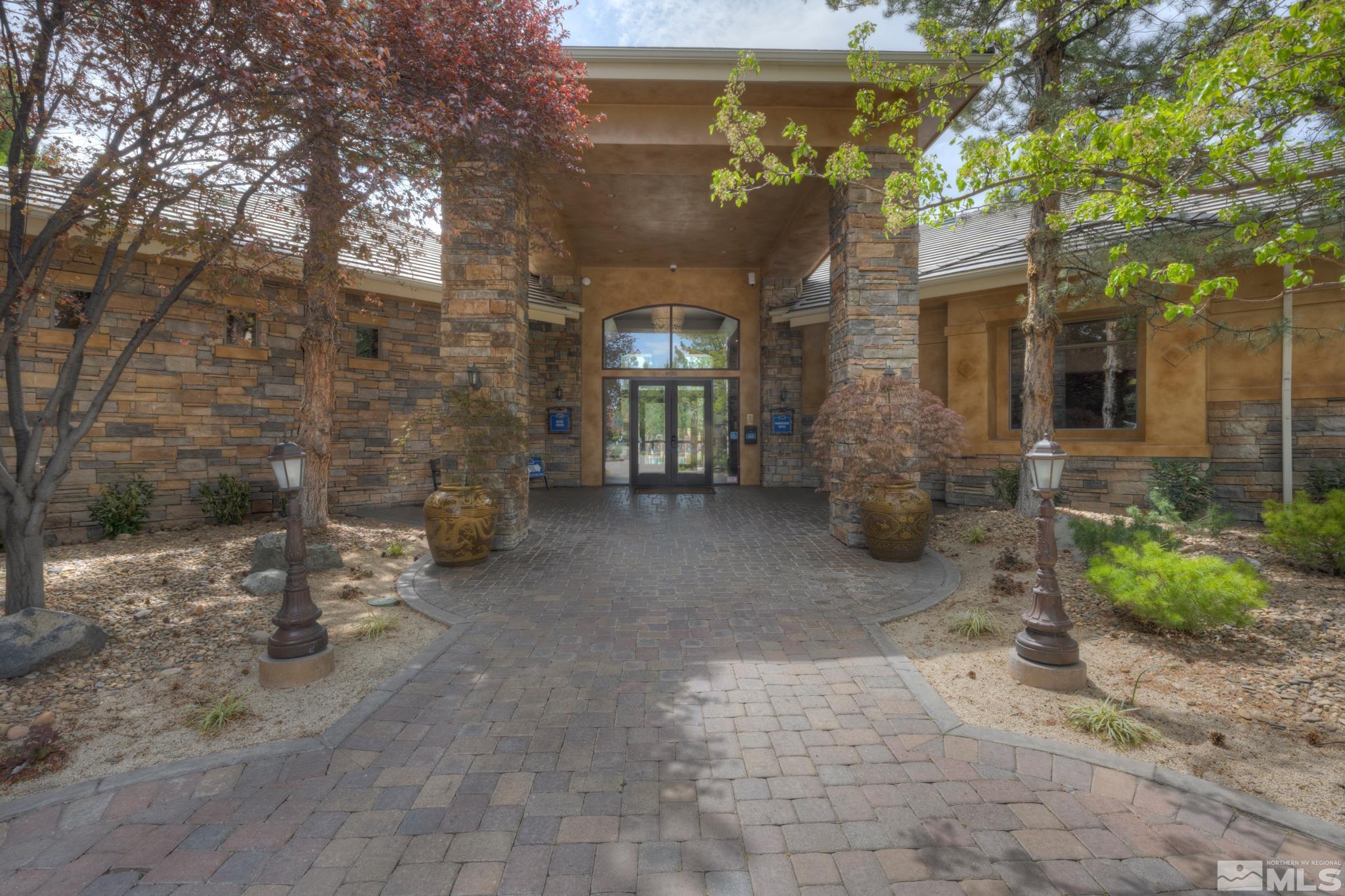 900 S Meadows, Unit 613 Reno, NV 89521 - Photo 27 of 40 a view of a patio with table and chairs and potted plants