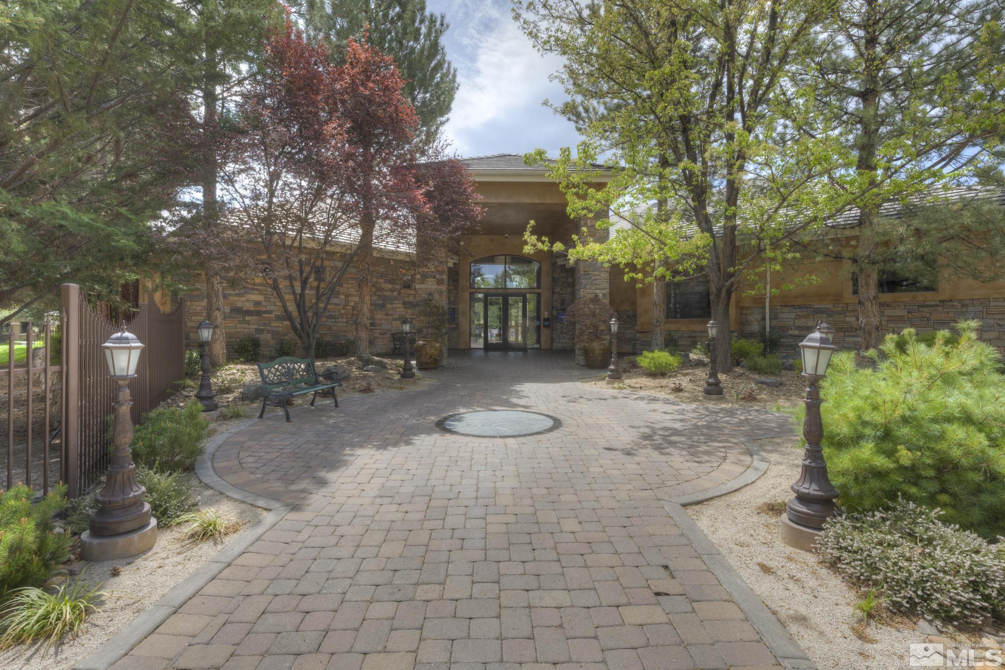 900 S Meadows, Unit 613 Reno, NV 89521 - Photo 28 of 40 a backyard of a house with yard and outdoor seating