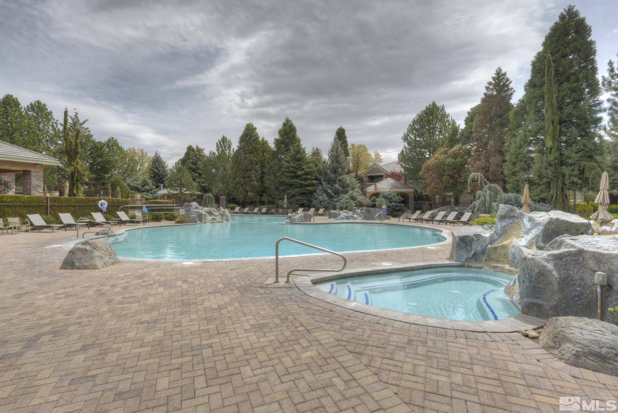 900 S Meadows, Unit 613 Reno, NV 89521 - Photo 29 of 40 a view of a swimming pool with a yard