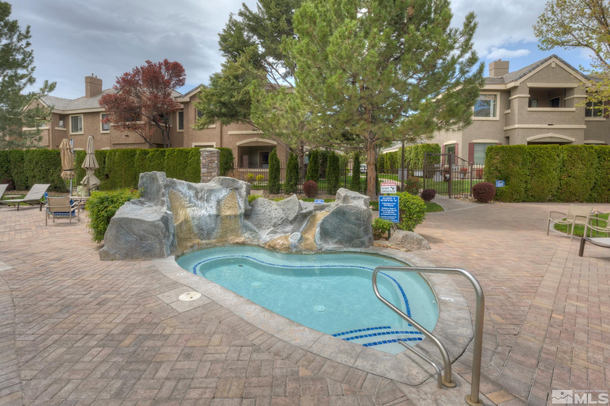 900 S Meadows, Unit 613 Reno, NV 89521 - Photo 30 of 40 a view of a house with a chairs in patio