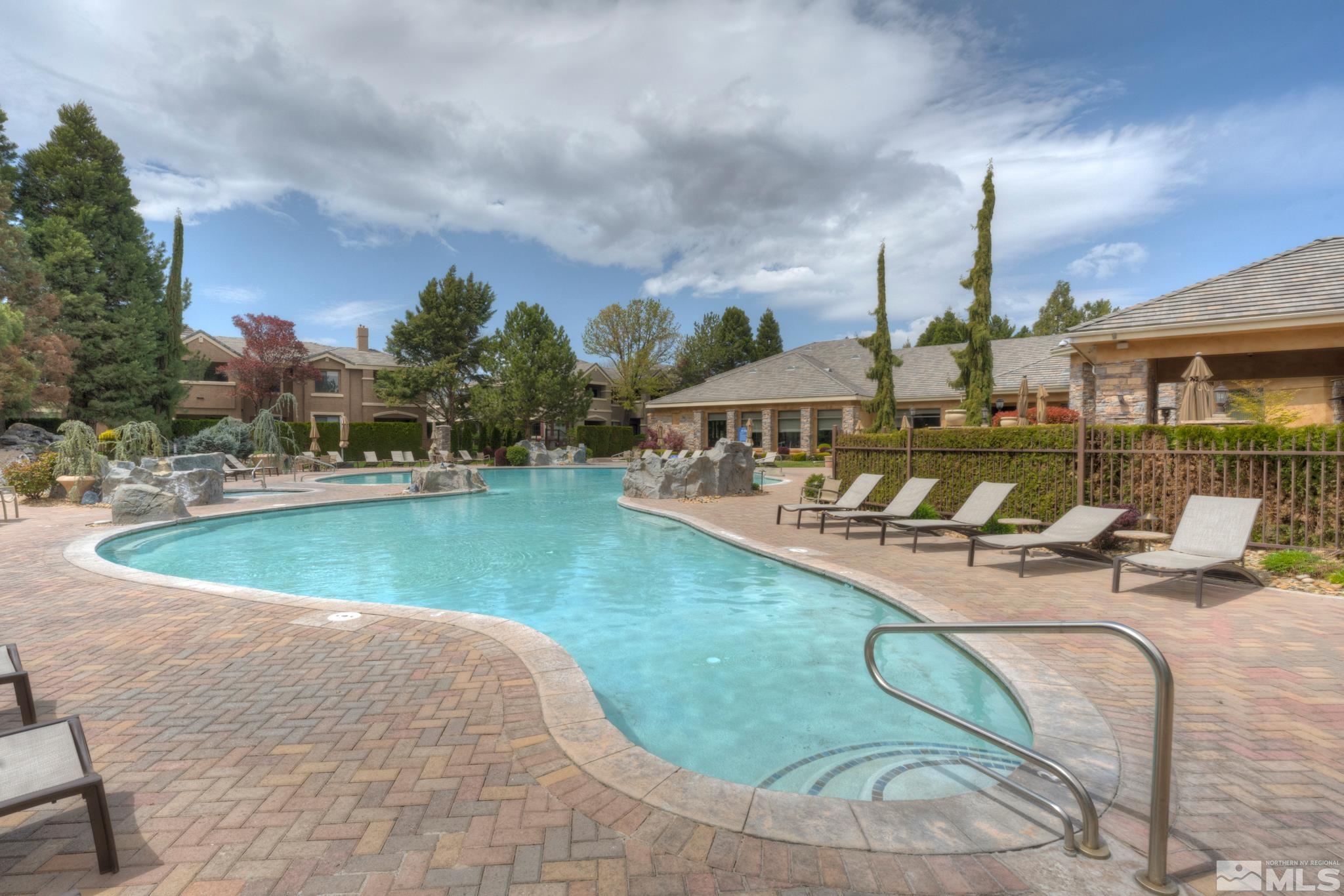900 S Meadows, Unit 613 Reno, NV 89521 - Photo 31 of 40 a view of a swimming pool with a patio