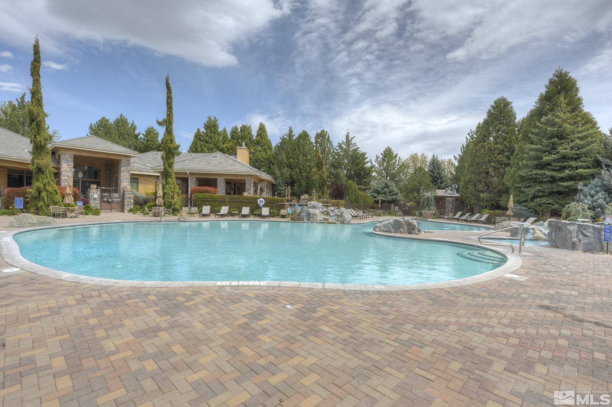 900 S Meadows, Unit 613 Reno, NV 89521 - Photo 32 of 40 a view of a swimming pool and a yard